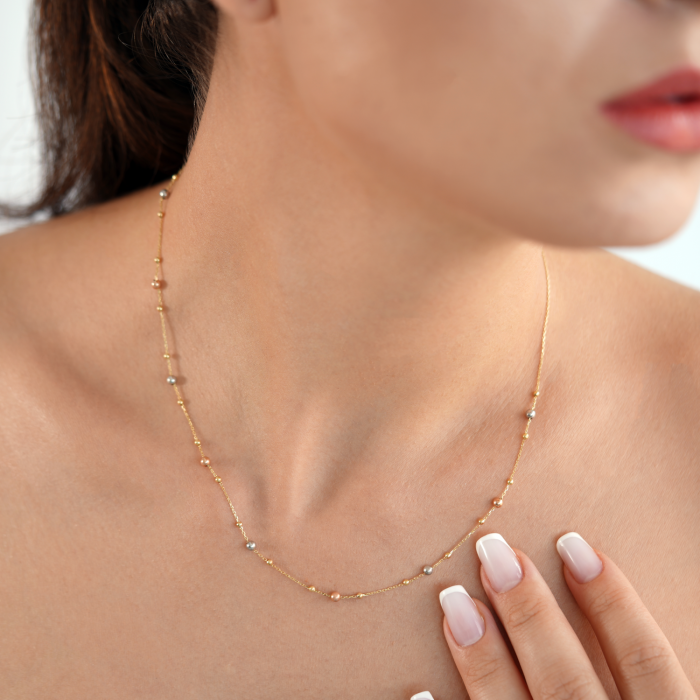 Halskette mit Kugeln aus 18 Karat Gelb-, Weiß- und Roségold Halskette mit Kugeln aus 18 Karat Gelb-, Weiß- und Roségold