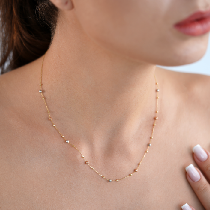 Halskette mit Kugeln aus 18 Karat Gelb-, Weiß- und Roségold Halskette mit Kugeln aus 18 Karat Gelb-, Weiß- und Roségold