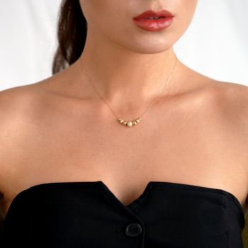 Halskette aus 18 Karat Gelbgold mit schlichten und glasierten Kugeln
